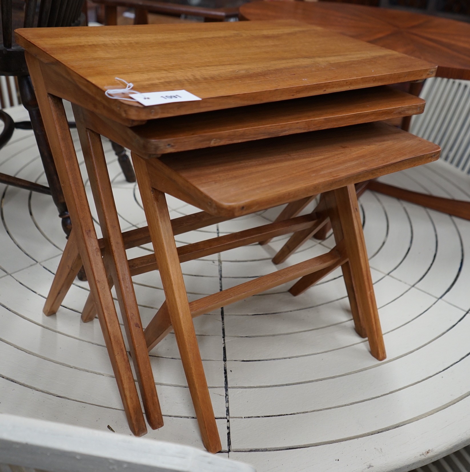 A mid century design nest of three rectangular tea tables, width 54cm, depth 35cm, height 50cm